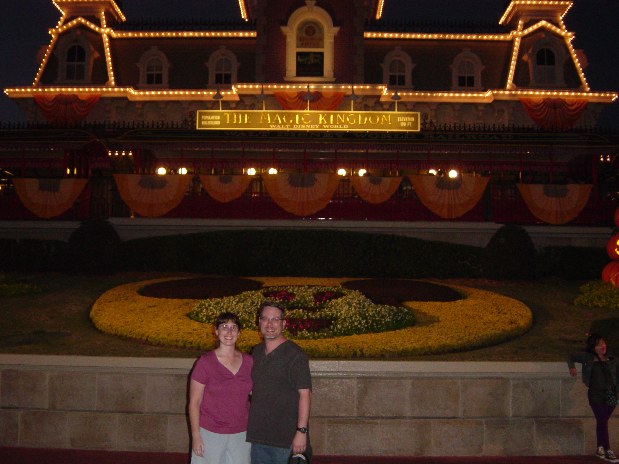 Julie and James in front of Disney Train Station at night