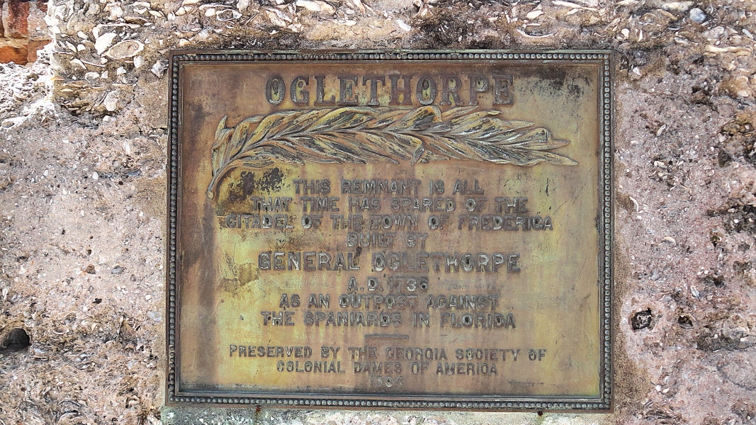A weathered bronze plaque reads “This Remnant is all that time has spared of the citadel of the town of Frederica built by General Oglethorpe AD 1736 as an outpost against the Spaniards in Florida. Preserved by the Georgia Society of Colonial Dames of America 1904.