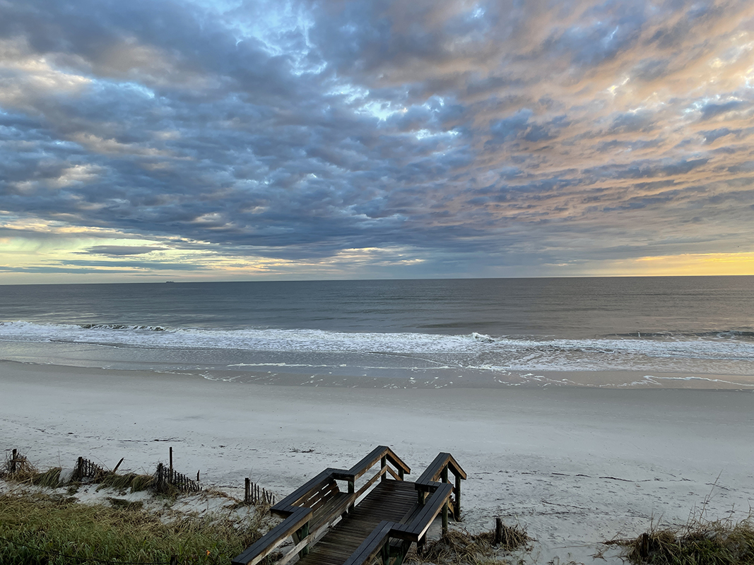 Clouds over the ocean with colored by the sunrise
