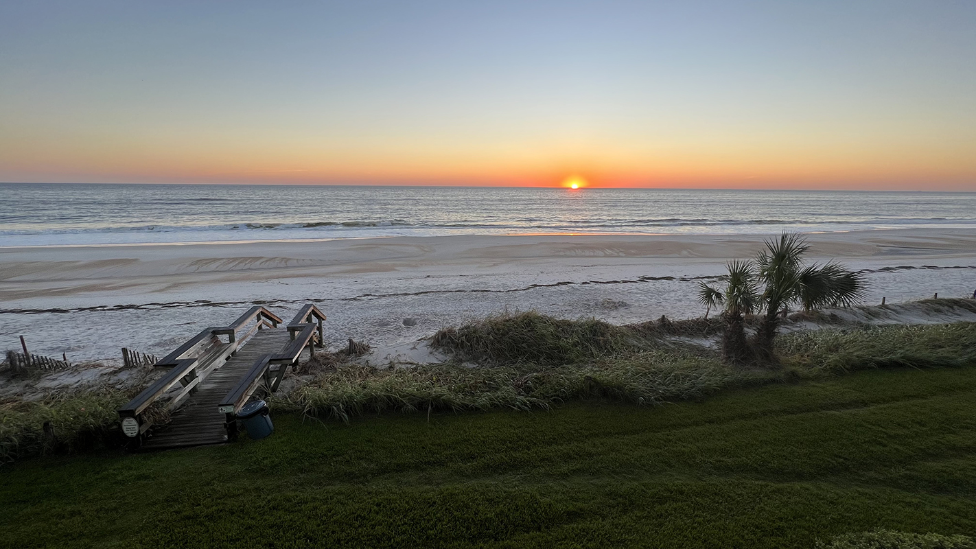 The sun just begins to peak over the horizon