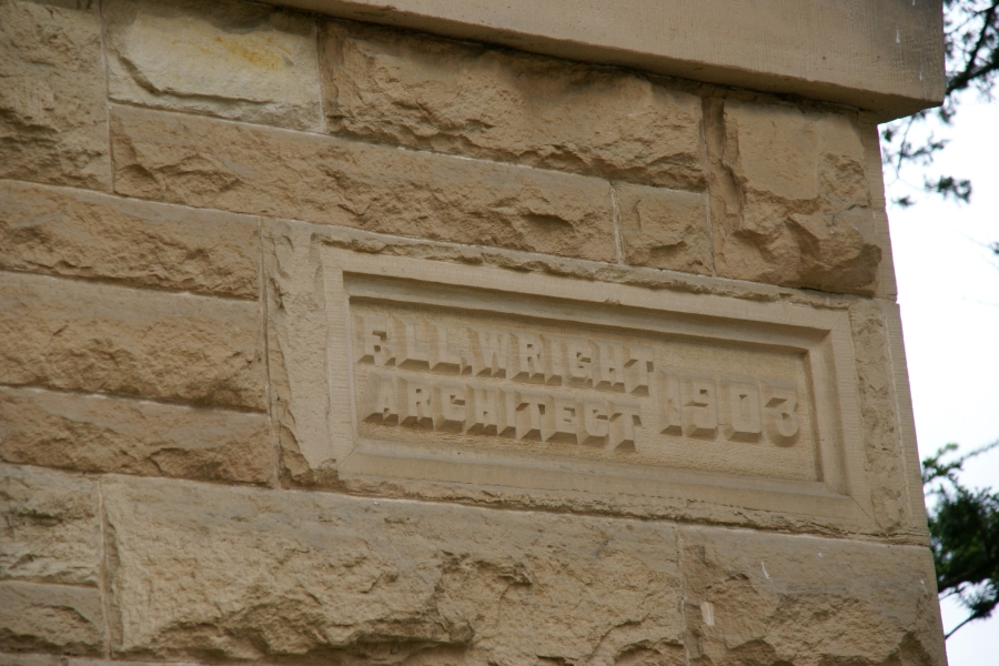 A yellow stone is carved with F. LL. Wright Architect 1903